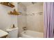 Clean bathroom with tub shower and updated tile at 1050 N Lafayette St # 408, Denver, CO 80218