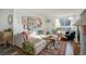 Living room with an eclectic decor, featuring a sectional sofa and gallery wall at 1050 N Lafayette St # 408, Denver, CO 80218