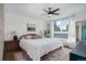 Spacious bedroom with large windows and ceiling fan at 1050 N Lafayette St # 408, Denver, CO 80218
