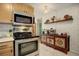 Updated kitchen with stainless steel appliances and stylish backsplash at 1050 N Lafayette St # 408, Denver, CO 80218