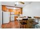 Eat-in kitchen with breakfast bar and wood cabinets at 9385 E Center Ave # 1D, Denver, CO 80247