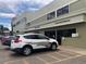 Community building exterior with fitness center and security patrol at 9385 E Center Ave # 1D, Denver, CO 80247