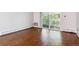 Living room with hardwood floors and patio access at 9385 E Center Ave # 1D, Denver, CO 80247