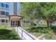 Attractive building exterior with landscaping and a welcoming entrance at 9385 E Center Ave # 1D, Denver, CO 80247