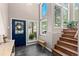Inviting entryway featuring a blue door and natural light at 12171 S Critchell Ln, Littleton, CO 80127