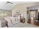 Bright and airy primary suite with a comfortable bed and plenty of natural light at 12171 S Critchell Ln, Littleton, CO 80127