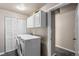 Convenient laundry room with washer, dryer, and extra storage at 12171 S Critchell Ln, Littleton, CO 80127