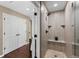 Walk-in shower with a built-in bench and pebble floor at 12171 S Critchell Ln, Littleton, CO 80127