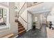 Bright and spacious entryway with staircase and tile flooring at 12171 S Critchell Ln, Littleton, CO 80127