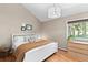 Charming bedroom with a king-size bed and plenty of natural light at 12171 S Critchell Ln, Littleton, CO 80127