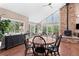 Charming dining room with wood floors and large windows at 12171 S Critchell Ln, Littleton, CO 80127