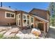 Walkout basement with large windows and stone accents at 12171 S Critchell Ln, Littleton, CO 80127