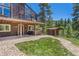 Home features a deck, hot tub, and wooded mountain views at 12171 S Critchell Ln, Littleton, CO 80127