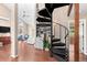 Modern spiral staircase leading to upper level at 12171 S Critchell Ln, Littleton, CO 80127