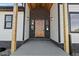 Inviting front entrance with wood door and stone accents at 44035 Pony Express Ct, Elizabeth, CO 80107