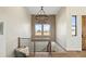 Elegant staircase with a modern railing and chandelier at 44035 Pony Express Ct, Elizabeth, CO 80107