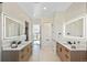 Large bathroom with dual vanities, and a view to a private deck at 44035 Pony Express Ct, Elizabeth, CO 80107