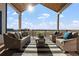 Relaxing outdoor deck with wicker furniture and stunning views at 44035 Pony Express Ct, Elizabeth, CO 80107
