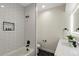 Clean bathroom with white subway tile, double vanity, and hexagon tile floor at 44035 Pony Express Ct, Elizabeth, CO 80107