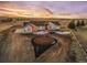 Aerial view of a house with a circular driveway and landscaping at 44035 Pony Express Ct, Elizabeth, CO 80107
