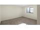 Simple basement bedroom with grey carpet and a window at 44035 Pony Express Ct, Elizabeth, CO 80107