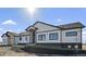 Single-story house with a landscaped yard and inviting front entrance at 44035 Pony Express Ct, Elizabeth, CO 80107
