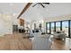 Open living area with hardwood floors and views into the kitchen and backyard at 44035 Pony Express Ct, Elizabeth, CO 80107
