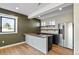 Modern basement bar with wood countertops, stainless steel appliances, and stylish cabinetry at 44035 Pony Express Ct, Elizabeth, CO 80107