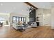 Spacious living room with hardwood floors, fireplace, and large windows at 44035 Pony Express Ct, Elizabeth, CO 80107