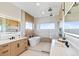 Spa-like bathroom with soaking tub, walk-in shower, and dual vanities at 44035 Pony Express Ct, Elizabeth, CO 80107