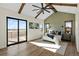 Main bedroom with wood beam ceiling, private deck access, and a serene atmosphere at 44035 Pony Express Ct, Elizabeth, CO 80107