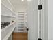 Bright and airy pantry with plenty of shelving for storage at 44035 Pony Express Ct, Elizabeth, CO 80107