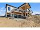 Two-story house with a large deck and patio, offering outdoor entertaining space at 44035 Pony Express Ct, Elizabeth, CO 80107