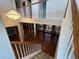 Two-story home interior with hardwood floors, chandelier, and open staircase at 6309 S Newbern Way, Aurora, CO 80016