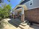 Back exterior view showing patio and partial home elevation at 6309 S Newbern Way, Aurora, CO 80016