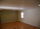Spacious living room with light walls and wood floors at 765 S Krameria St, Denver, CO 80224