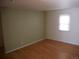 Simple living room with light wood floors and two-toned painted walls at 765 S Krameria St, Denver, CO 80224