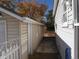 Side yard with concrete walkway between structures at 765 S Krameria St, Denver, CO 80224