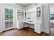 Home office with built-in shelving and a view from the French doors at 110 N Franklin St, Denver, CO 80218