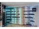 Modern wine cellar with extensive climate-controlled racking at 110 N Franklin St, Denver, CO 80218