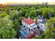 Elegant home with a red tile roof, nestled in a lush, tree-lined neighborhood at 110 N Franklin St, Denver, CO 80218