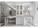 Elegant bathroom with double vanity, marble flooring and large shower at 110 N Franklin St, Denver, CO 80218