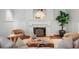 Cozy living room with fireplace, hardwood floors, and comfortable seating at 110 N Franklin St, Denver, CO 80218