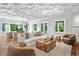 Bright living room with hardwood floors, a coffered ceiling, and comfortable seating at 110 N Franklin St, Denver, CO 80218