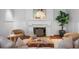 Elegant living room with fireplace, hardwood floors, and comfortable seating at 110 N Franklin St, Denver, CO 80218