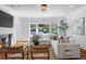 Light-filled living room features hardwood floors and a cozy fireplace at 110 N Franklin St, Denver, CO 80218