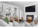 Cozy Gathering room boasts a fireplace and views into the kitchen at 110 N Franklin St, Denver, CO 80218