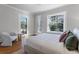 Charming bedroom with hardwood floors and a view from the large window at 110 N Franklin St, Denver, CO 80218