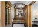 Grand entryway with a staircase, hardwood floors, and a half bathroom at 110 N Franklin St, Denver, CO 80218