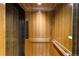 Modern elevator with wood paneling, adding convenience and luxury at 110 N Franklin St, Denver, CO 80218